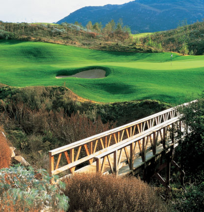 Maderas Golf Club green with bridge of wash in foreground