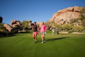 Group of people walking on the golf course