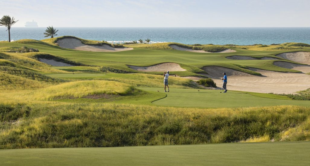Two Golfers at Saadiyat Beach Golf Club in Abu Dhabi