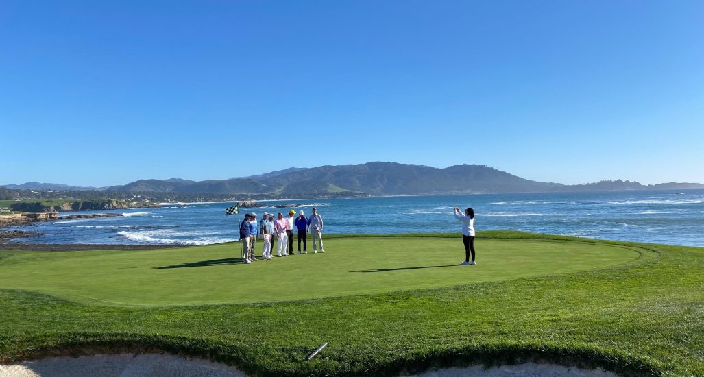 Pebble Beach 18th Green with Players taking a picture
