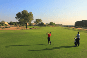 Two golfers on the golf course at Arabian Ranches Golf Club