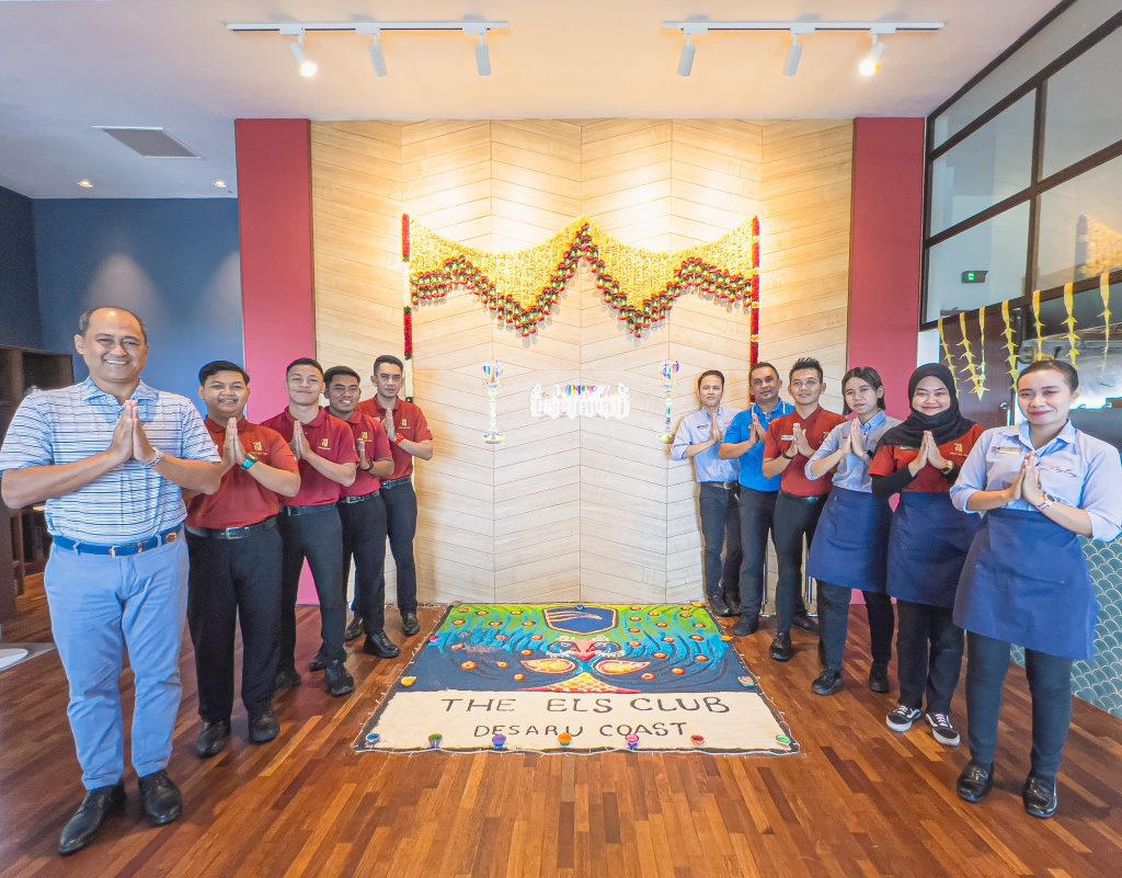 Associates in front of the Diwali Kolam at Els Club Desaru Coast