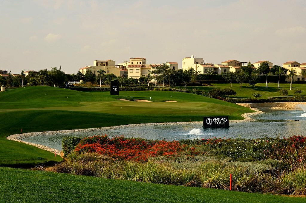 A view of the golf course on hole 12 at Madinaty Golf Club wit Asian Tour signage