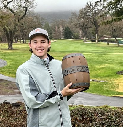 Garrett Boe holds the trophy of the Grapevine Amateur