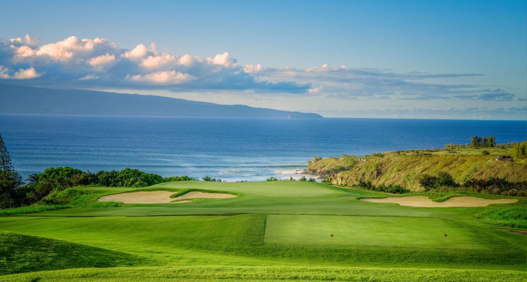 Hole 11 at Kapalua Plantation Course with ocean in background