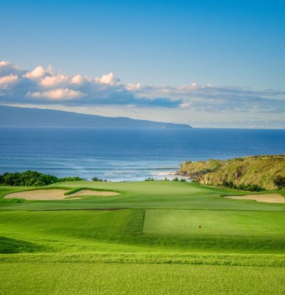 Hole 11 at Kapalua Plantation Course with ocean in background