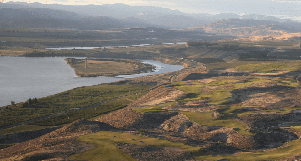 Aerial view of Gamble Sands with the Columbia River and mountains in the background.