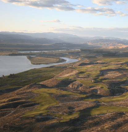 Aerial view of Gamble Sands with the Columbia River and mountains in the background.