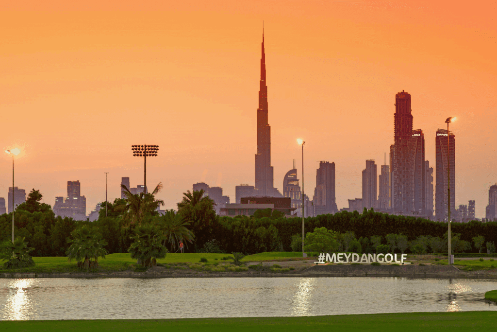 Golf course at sunset with view of the Burj Khalifa at The Track, Meydan Golf