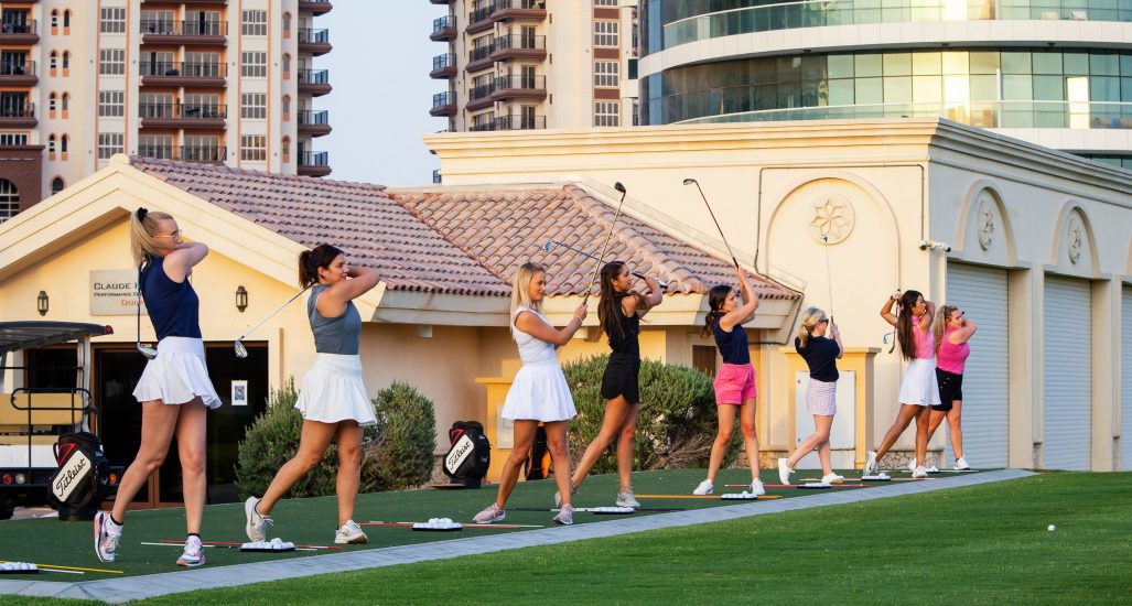 Female golfers on the driving range at The Claude Harmon 3 Performance Golf Academy at The Els Club Dubai