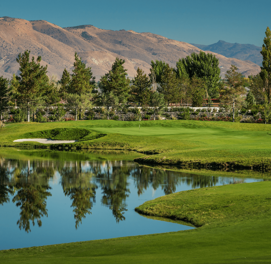 View of Redhawk golf course, showcases the mountains, trees, and water
